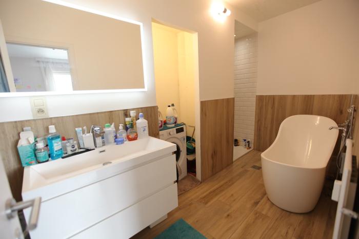 Bathroom with tube and shower